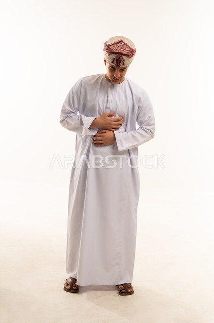 Omani Man in Traditional Dress with Stomach Pain