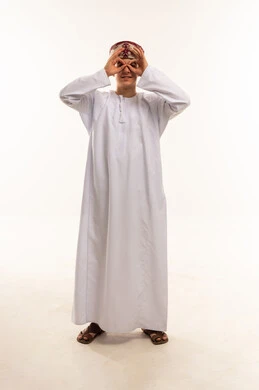 Omani Man in Traditional Dishdasha Making Binoculars Gesture