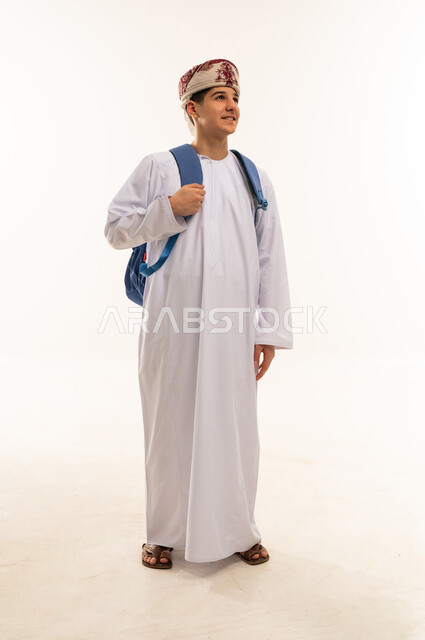 Omani Student in Traditional Dishdasha with Backpack