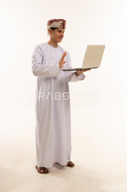 Omani Man Using Laptop on White Background