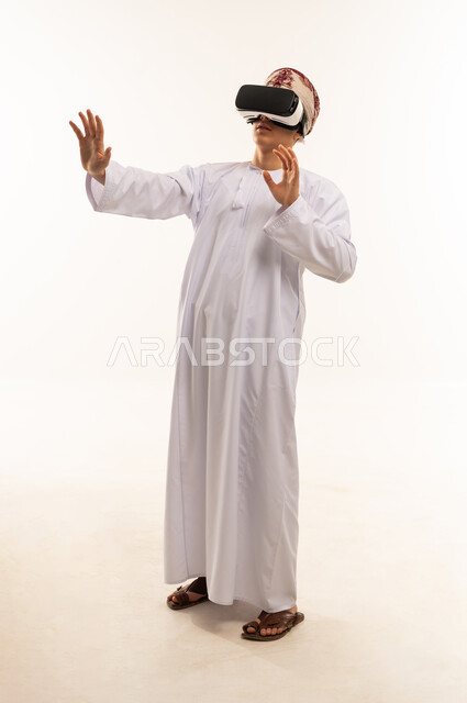 Omani Man Using VR Headset in White Studio