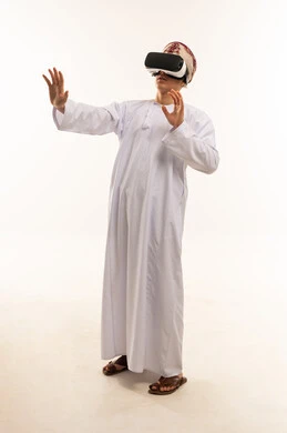 Omani Man Using VR Headset in White Studio
