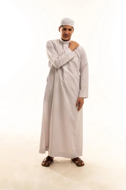 Saudi Man with Shoulder Pain in White Thobe