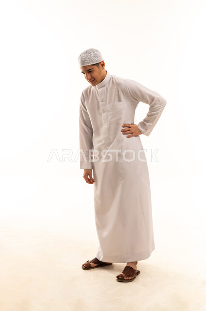 Saudi Man in White Thobe Standing on White Background