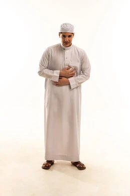 Saudi Man Holding Abdomen with Stomach Pain Studio Shot
