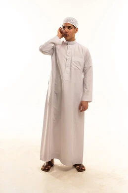 Saudi Boy in White Thobe on White Background