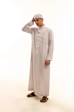 Confused Saudi Man in Traditional White Thobe