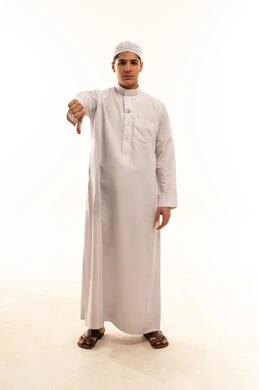 Saudi Teenage Boy in Thobe Giving Thumbs Down