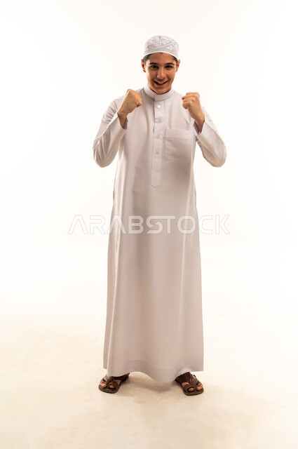 Saudi Youth in Traditional Thobe Celebrating Victory