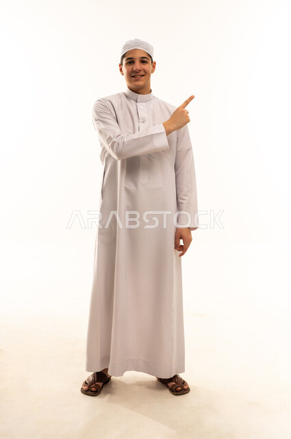 Arab Youth in White Thobe Pointing on White Background