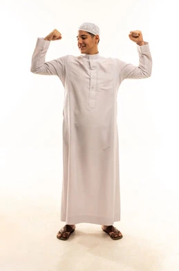Arab Man Flexing Muscles in White Thobe Studio