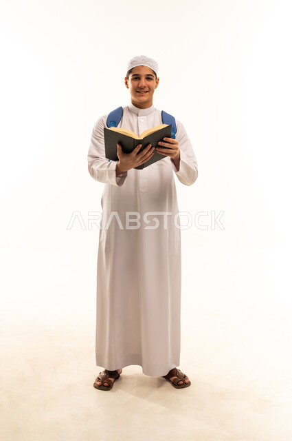 Arab Student in White Thobe Holding Book