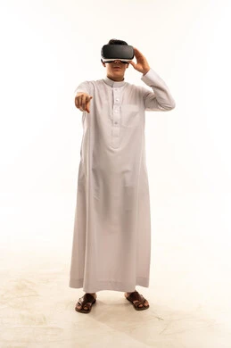 Saudi Boy Wearing VR Headset Pointing Forward