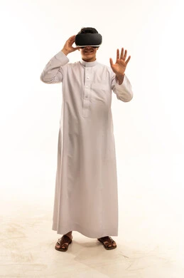 Saudi Man Using Virtual Reality Headset on White