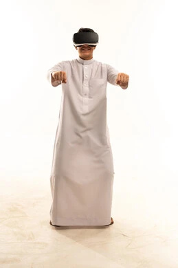 Saudi Man Using VR Headset in White Studio