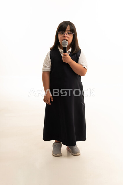 Saudi Girl with Down Syndrome Holding a Microphone