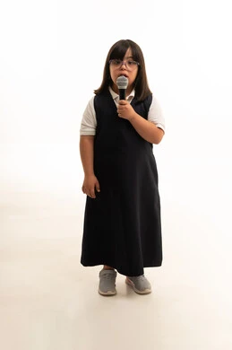 Saudi Girl with Down Syndrome Holding a Microphone