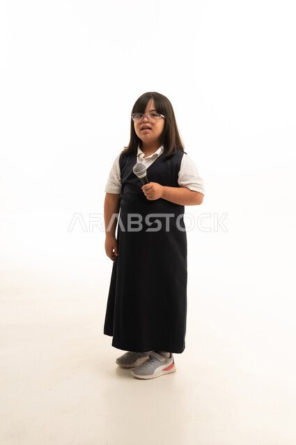 Saudi Girl with Down Syndrome Holding Microphone