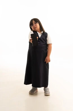 Saudi Girl with Down Syndrome Holding Smartphone