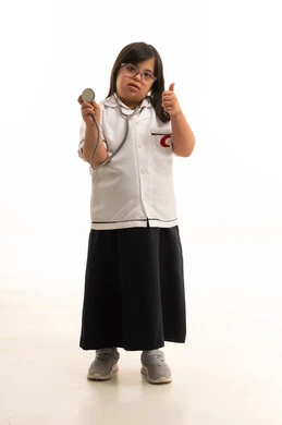 Arab Girl with Down Syndrome in Doctor Uniform Studio