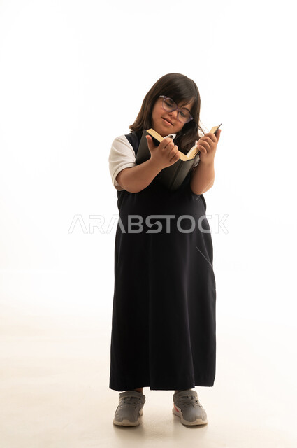 Saudi Girl with Down Syndrome Reading Book