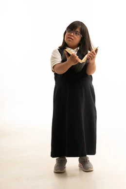 Arab School Girl with Down Syndrome Holding Book