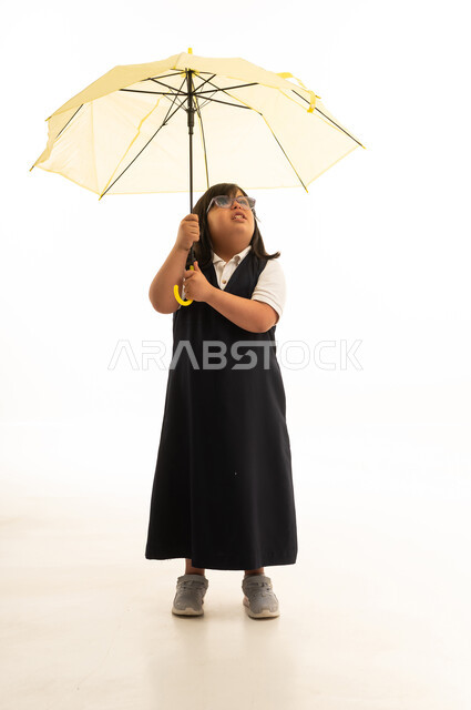 Saudi Girl with Down Syndrome Holding Umbrella