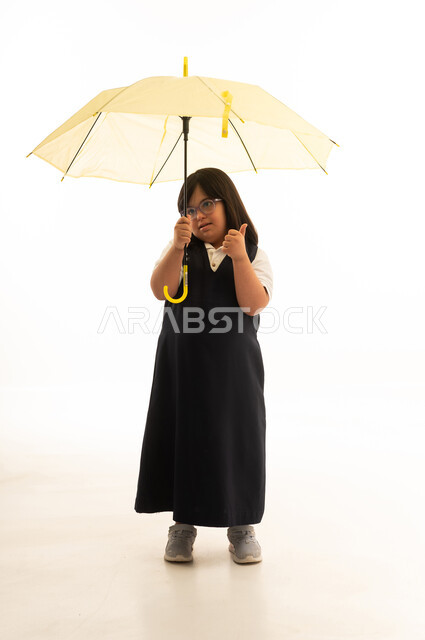 Saudi Schoolgirl with Down Syndrome Holding Umbrella