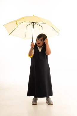 Saudi Girl with Down Syndrome Holding Umbrella