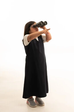 Saudi School Girl with Binoculars on White Background