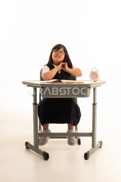 Saudi Student with Down Syndrome at School Desk