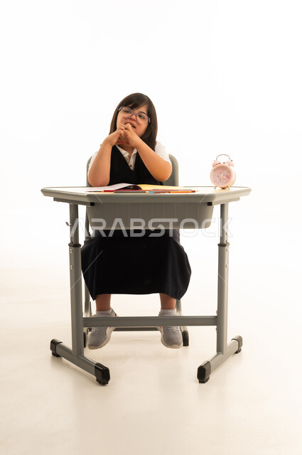 Saudi Girl with Down Syndrome at School Desk