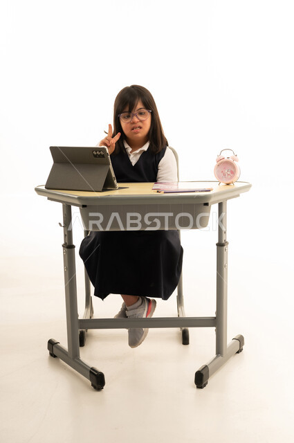Saudi Girl with Down Syndrome at School Desk