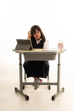 Saudi Girl with Down Syndrome at School Desk