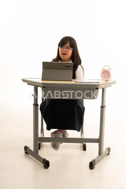 Saudi Girl with Down Syndrome at School Desk