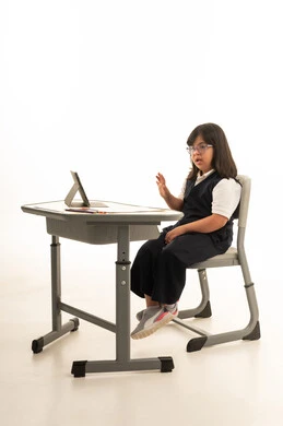 Saudi Girl with Down Syndrome at School Desk