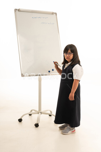 Arab School Girl with Down Syndrome at Whiteboard