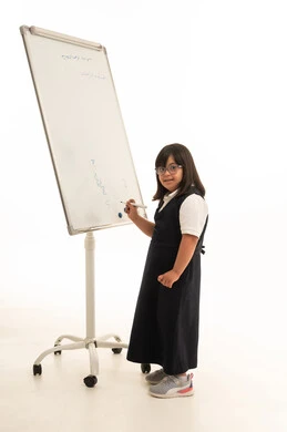 Arab Girl with Down Syndrome Writing on Whiteboard