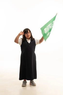 Saudi Girl with Down Syndrome Saluting with National Flag