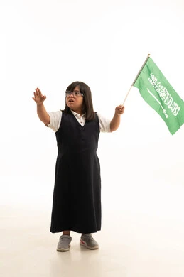 Saudi Girl with Down Syndrome Holding National Flag