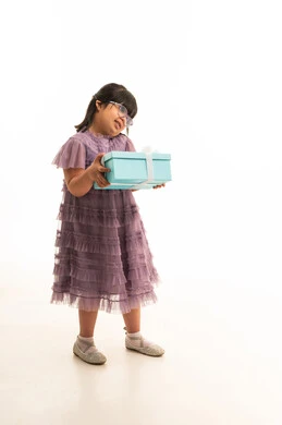 Arab Girl in Purple Dress Holding Blue Gift Box