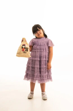 Arab Girl with Down Syndrome in Purple Dress