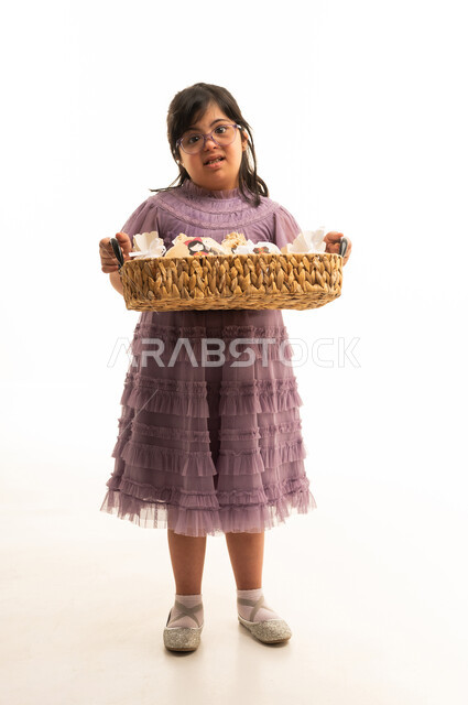 Saudi Girl with Down Syndrome Holding Woven Basket