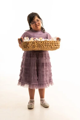 Arab Girl with Down Syndrome Holding Gift Basket