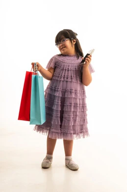 Saudi Girl with Down Syndrome Shopping with Smartphone