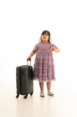 Arab Girl with Down Syndrome and Suitcase