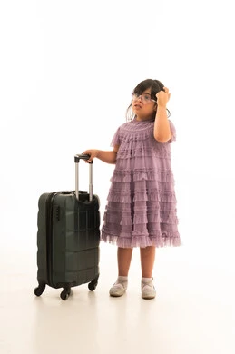 Arab Girl with Down Syndrome and Suitcase on White Background