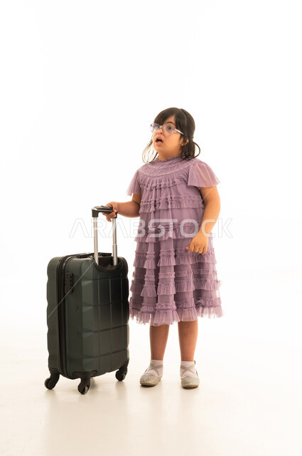 Arab Girl with Down Syndrome Holding Travel Suitcase