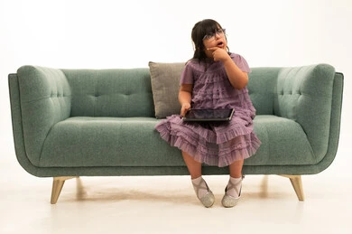 Saudi Girl with Down Syndrome Using Tablet Saudi Girl with Down Syndrome Using Tablet