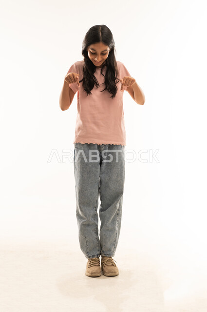 Arab Girl Pointing Downward on White Background